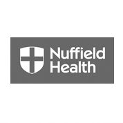 A grey and white logo of nuffield health