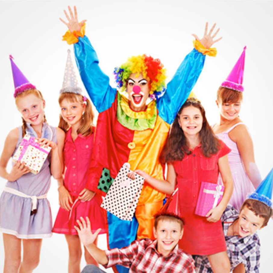 A group of children posing with a clown.