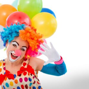 A clown with balloons on his head and gloves