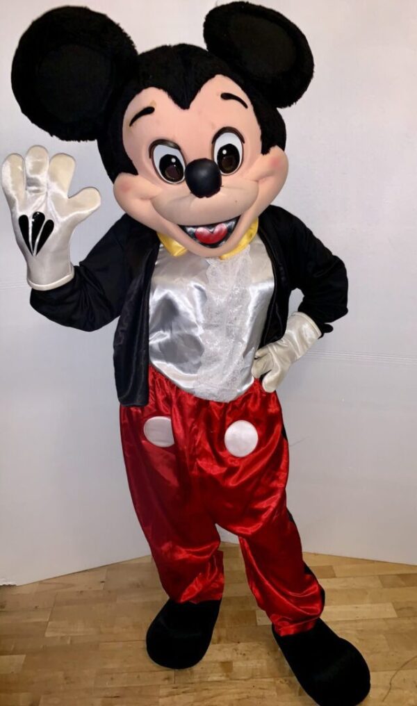 A mickey mouse character waving to the camera.