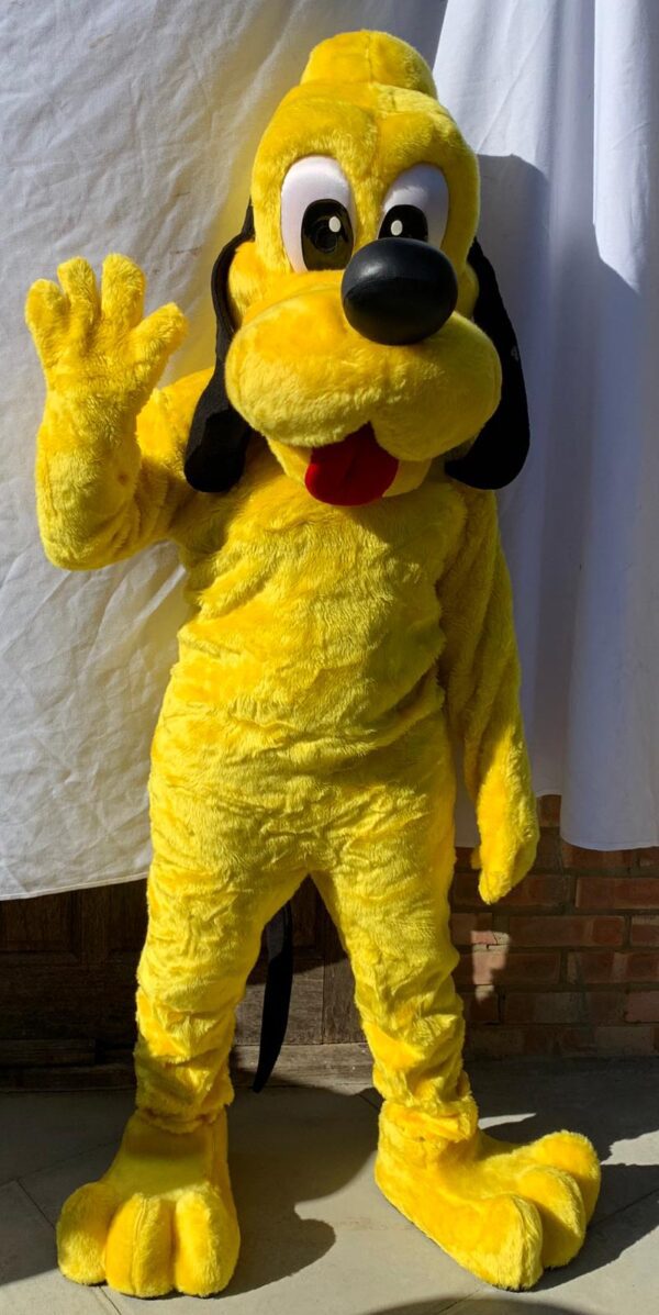 A yellow dog mascot with black ears and paws.