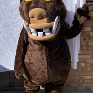 A bear mascot with teeth and yellow eyes.