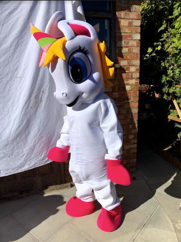 A person in a unicorn costume standing outside.