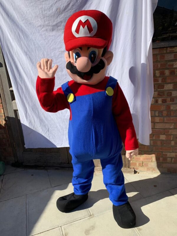 A person in a mario costume waving