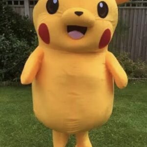 A person in pikachu costume standing on grass.