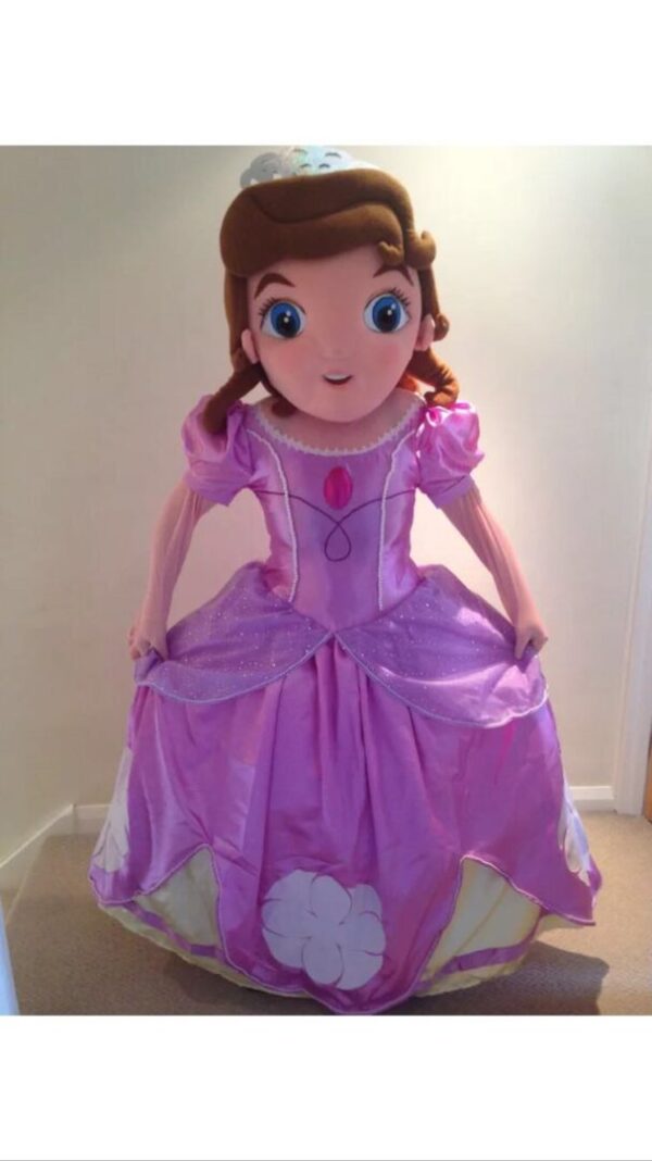 A large doll dressed in purple dress and hair.