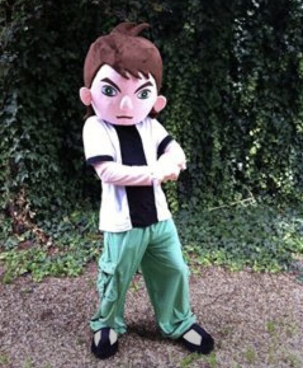 A boy in green pants and white shirt